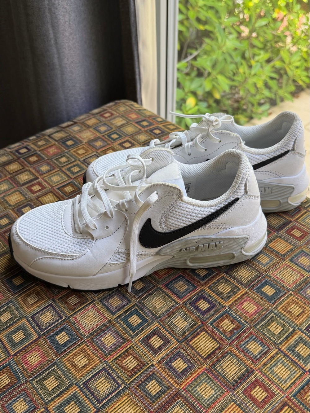 Nike Kids White Sneakers with Black Swoosh